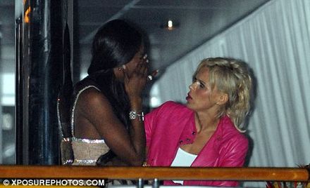 Emotional: the supermodel is comforted by a concerned friend Emotional: the supermodel is comforted by a concerned friend