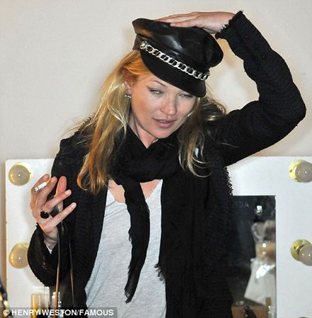 Kate Moss smokes a cigarette out car window then in fashion show