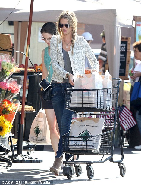 Rosie Huntington-Whiteley shows style as she stocks up on food