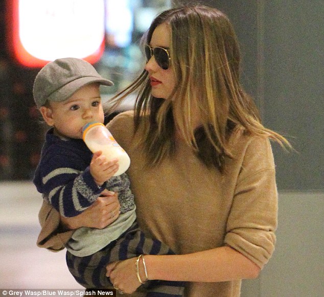 Hot model Miranda Kerr and baby Flynn land in Sydney Airport