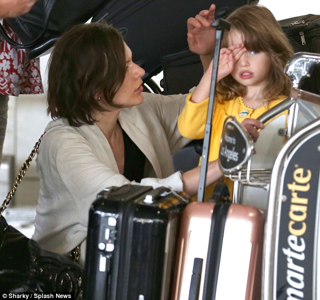 Milla Jovovich looks fabulous after long flight