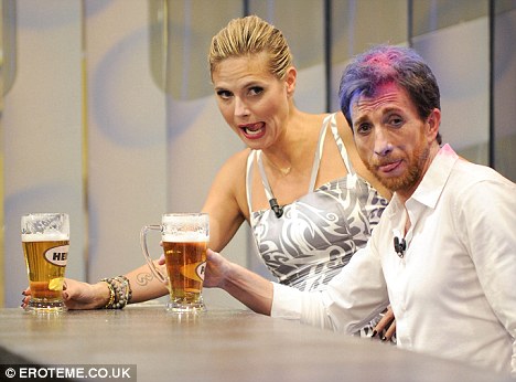 Heidi Klum shows her beer guzzling skills on Spanish TV