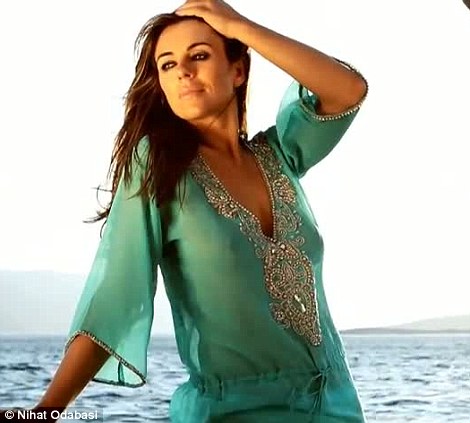 Liz Hurley flaunts her fab body for 2013 Beach Collection