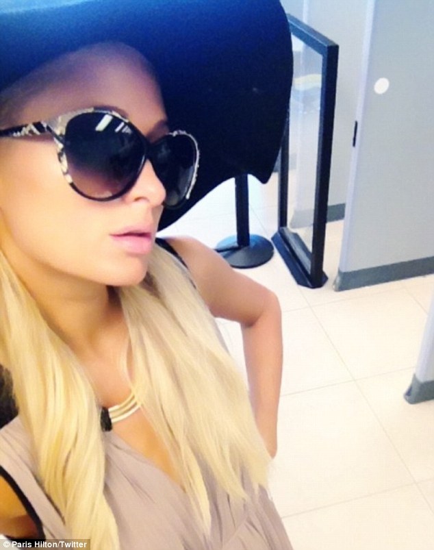 Paris Hilton makes a glamorous exit out of LAX and on to China