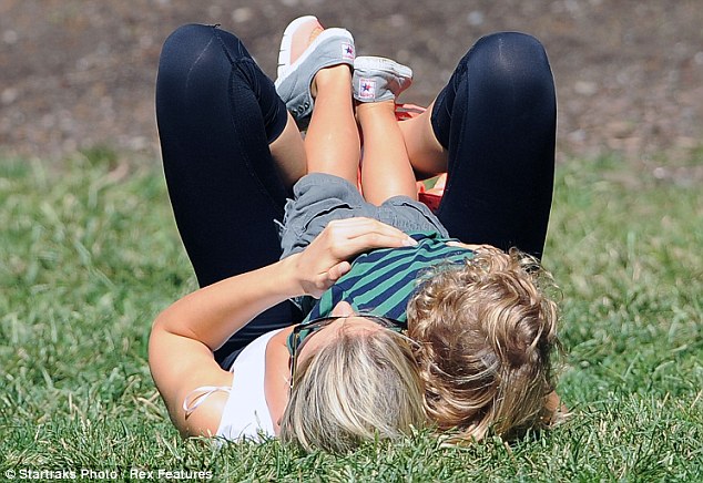 Karolina Kurkova goes for a stroll with husband and son