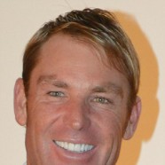 Shane Warne flashes blindingly white teeth at Red Carpet event