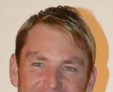 Shane Warne flashes blindingly white teeth at Red Carpet event