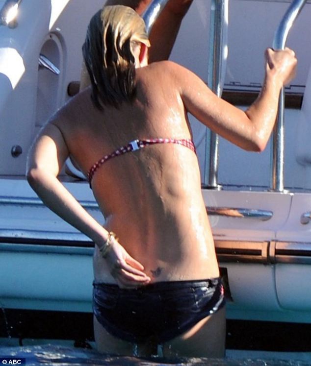 Supermodel Kate Moss goes topless in France and flaunts her Lucian Freud tattoos