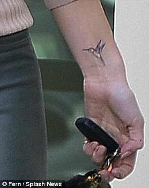 Rosie Huntington-Whiteley shows off her latest tattoo