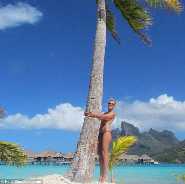 Heidi Klum posts another ‘topless selfie’ as she hugs a tree!