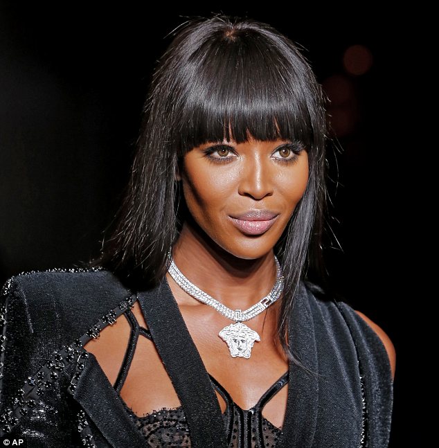 Naomi Campbell opens Versace fashion show and struts her stuff