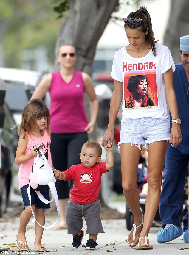Alessandra Ambrosio watches proudly as son Noah takes his first steps!