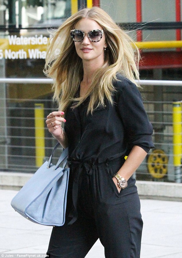 Rosie Huntington-Whiteley exits a Marks & Spencer store looking supermodel perfect