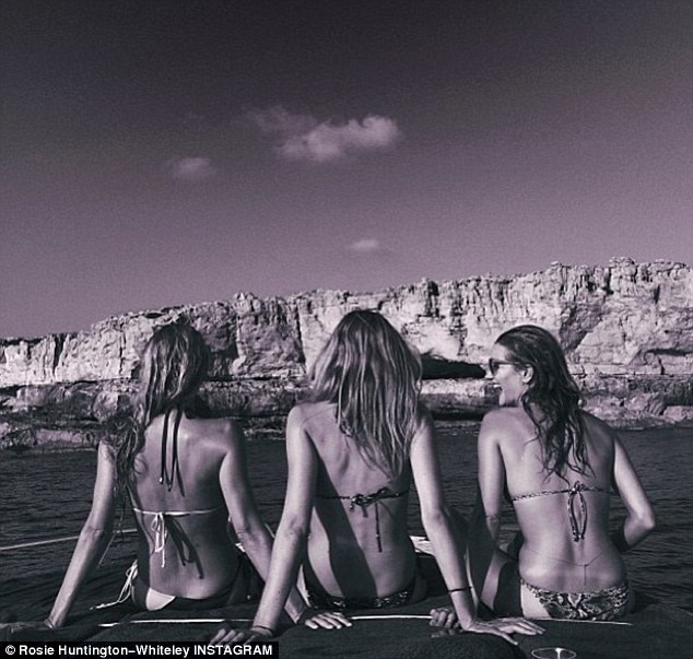 Rosie Huntington-Whiteley laps up the rays on Ibiza holiday
