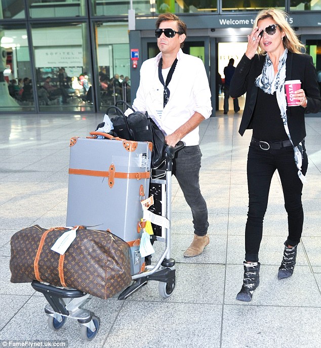 Kate Moss plants a huge one on hubby Jamie Hince!