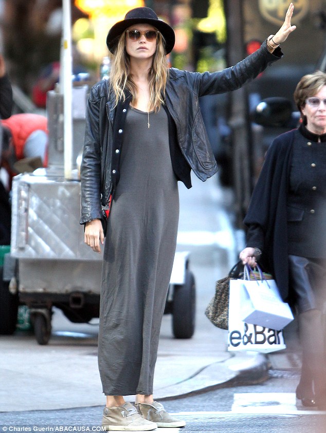 Behati Prinsloo hails a cab in New York City