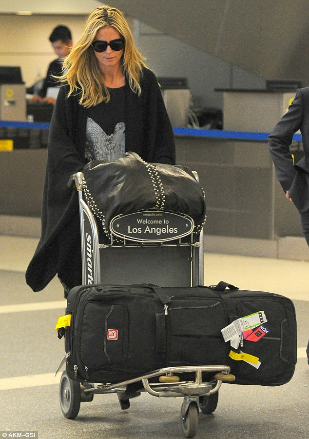 Heidi Klum arrives at LAX looking supermodel perfect!