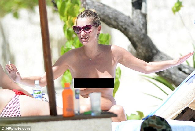 Kate Moss lets it all hang out on holiday