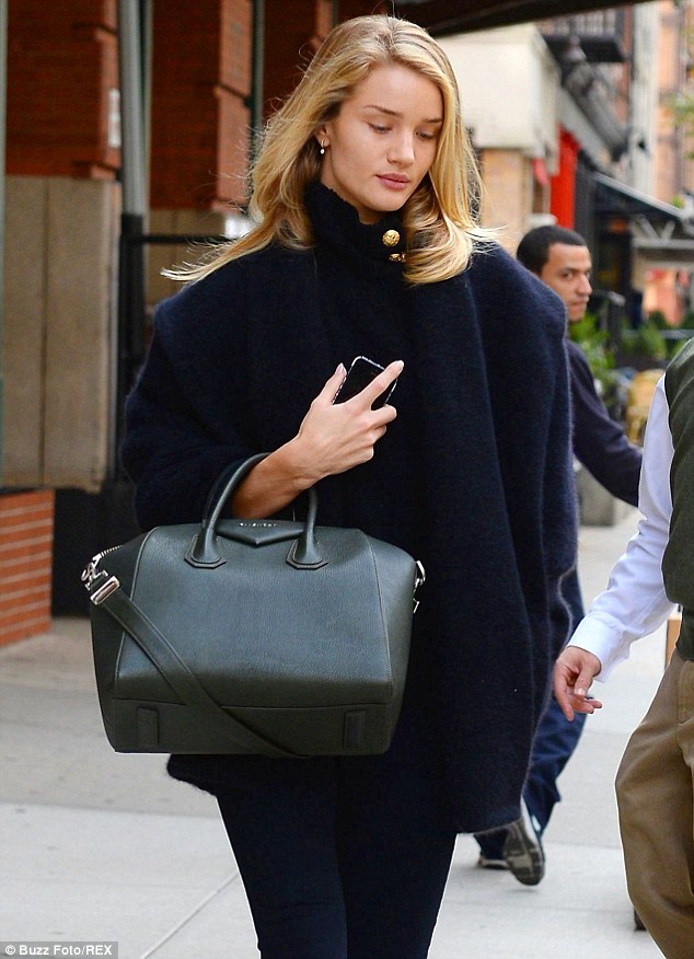 Rosie Huntington-Whiteley shows off classy chic as she struts her stuff